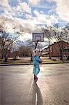 Sweden, Vastergotland, Lerum, Girl (10-11) playing basketball