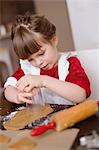 Sweden, Girl (4-5) making gingerbread cookies