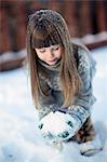 Sweden, Vasterbotten, Little girl (4-5) playing with snow