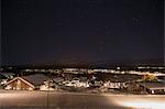 Sweden, Vasterbotten, Hemavan, Wooden houses at ski resort at night