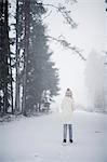 Sweden, Vastmanland, Bergslagen, Girl (8-9) in winter forest