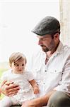 Sweden, Varmland, Filipstad, Gasborn, Horrsjon, Portrait of man with baby girl (12-17 months)