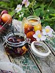 Sweden, Preserved plums in jars on table