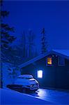 Sweden, Jamtland, Bydalsfjallen, View of house and car in ski resort at night