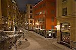 Sweden, Stockholm, Gamla Stan, Osterlanggatan, Illuminated city street in winter