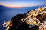 View of the Aegean Sea from the typical Greek village of Oia at dusk, Santorini, Cyclades, Greek Islands, Greece, Europe