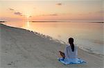 Woman practising yoga at sunrise, Rasdhoo Island, Northern Ari Atoll, Maldives, Indian Ocean, Asia
