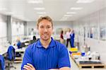 Portrait smiling worker in steel factory office