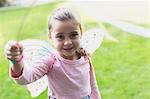 Portrait smiling girl in fairy wings