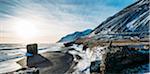 Sun shining over icy beach and mountains, Iceland