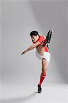 Portrait of Japanese rugby player kicking