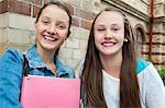 Sweden, Vastra Gotaland, Gothenburg, Portrait of two smiling girls (14-15)