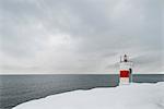 Sweden, Stockholm archipelago, Sodermanland, Femore, Lighthouse on snowy coastline
