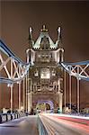 UK, England, London, Traffic light trail along Tower Bridge at night