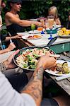 Sweden, Man holding frying pan with food