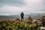 Sweden, Sylama, Jamtland, Man hiking in mountains