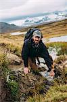 Sweden, Sylama, Jamtland, Portrait of young man hiking in mountains