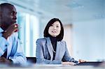 Serious businesswoman listening in meeting