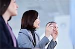 Businesswoman gesturing and explaining in meeting