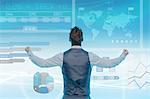 Man looking at data on graphical screen, fists clenched, rear view