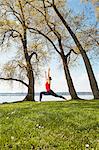 Side view of woman arms raised in yoga position