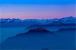 Elevated mountain landscape with valley mist at sunrise, Monte Generoso,Ticino, Switzerland