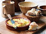 Baked cheese in terracotta dish