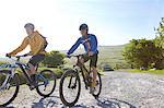 Cyclists cycling on rural road