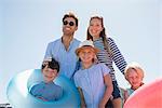 Portrait of a happy family enjoying on the beach