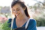 Close-up of a beautiful young woman gardening