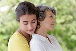 Loving young woman hugging her mother