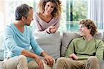 Happy family smiling in a living room at home