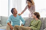 Family having a discussion in living room at home