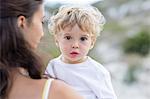 Close-up of a baby boy with his mother