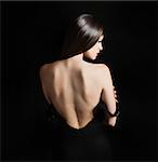 Back of a woman with black dress