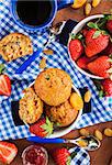 Breakfast with homemade carrot muffins, jam, coffee and fresh strawberry