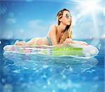 Sunbathe on an airbed in the sea