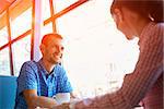 Two people in cafe enjoying the time spending with each other