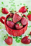 Fresh organic strawberries  in a red mug