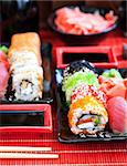 Assorted of fresh delicious sushi and rolls on table, japanese food