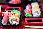 Assorted of fresh delicious sushi and rolls on table, japanese food