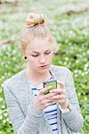 Young woman using phone