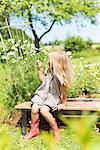 Young girl sitting on bench