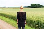 Blond woman looking at field