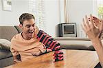 Couple playing wooden block building game