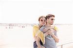Couple by beach hugging, Coney island, Brooklyn, New York, USA