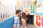 Couple at tunnel entrance kissing, Coney island, Brooklyn, New York, USA