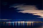 Distant skyline and city lights at night, Seattle, Washington, USA