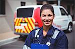 Portrait of a smiling ambulance woman in the street