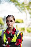 Portrait of a stern ambulance woman with arm crossed